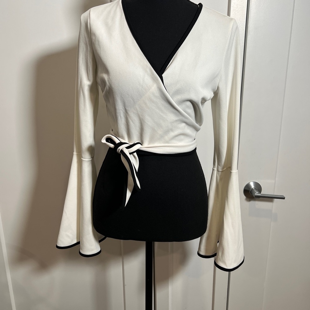 Elegant White Wrap Top with Black Trim